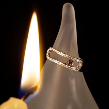 0.05ct natural alexandrite ring in 18k white and rose gold with diamond accents and moving bezel design